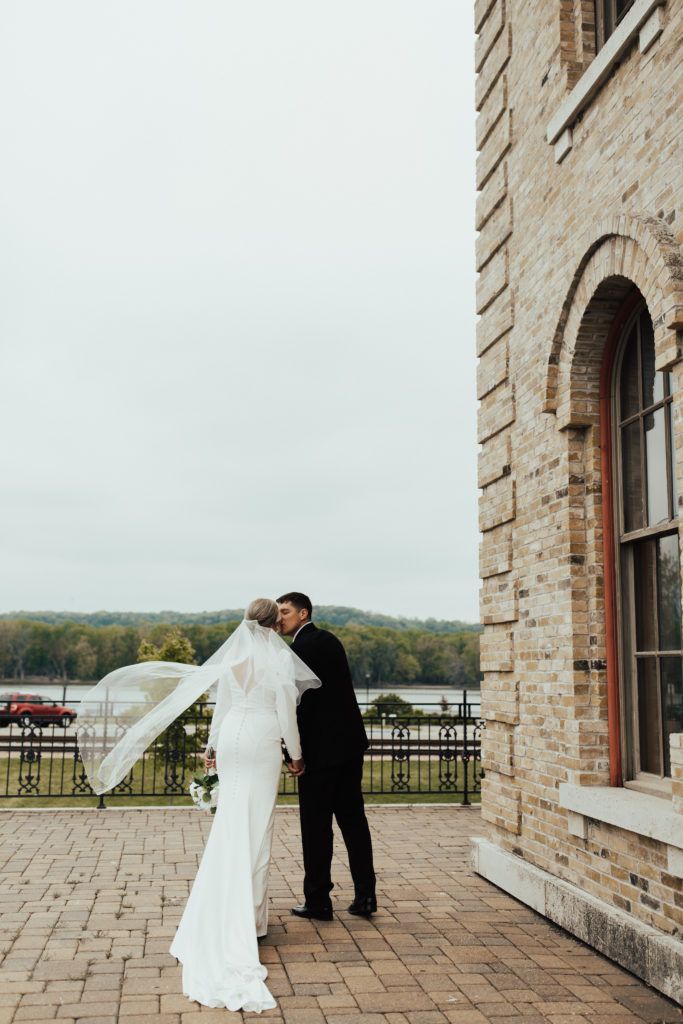 Elegant bride and groom portraits at their venue the Dousman House in Prairie du Chien, WI.