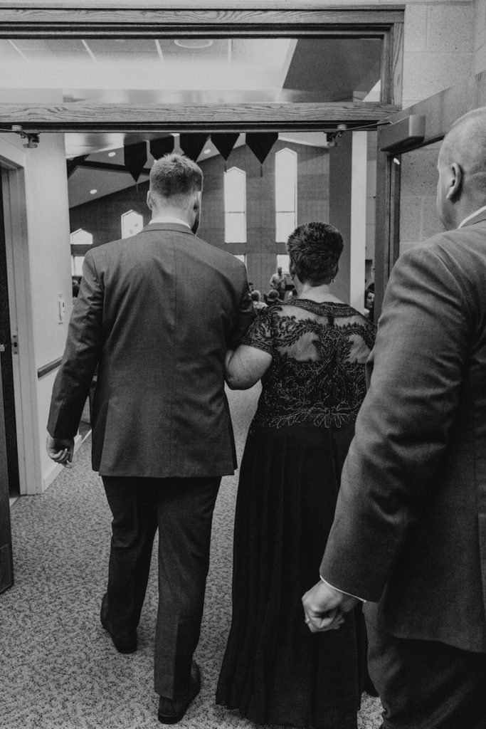 Groom and his mother walking down the aisle at the St. Paul Lutheran Church in Iowa. 
