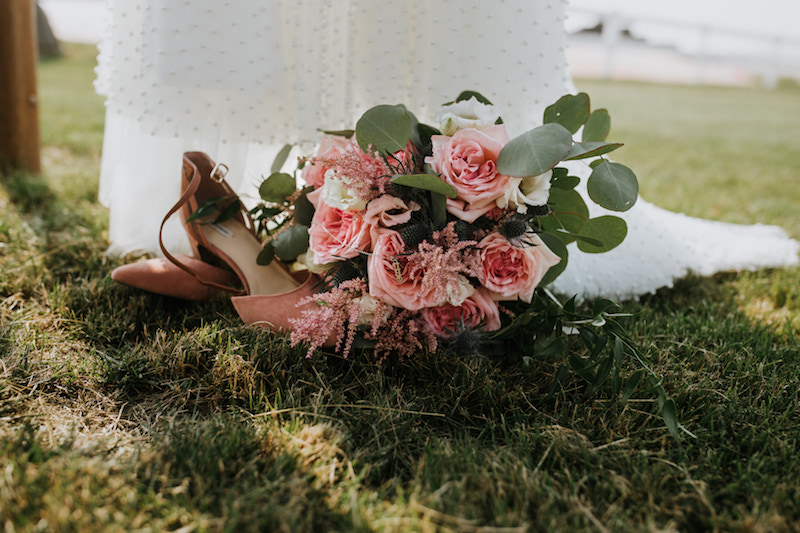 Bridal bouquet and shoes detail shot by Aubree Taylor Photo, Iowa wedding photographer.