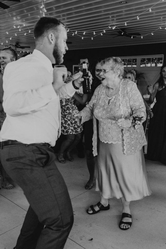 Groom and his grandma dancing at his midwest summer wedding in Iowa.