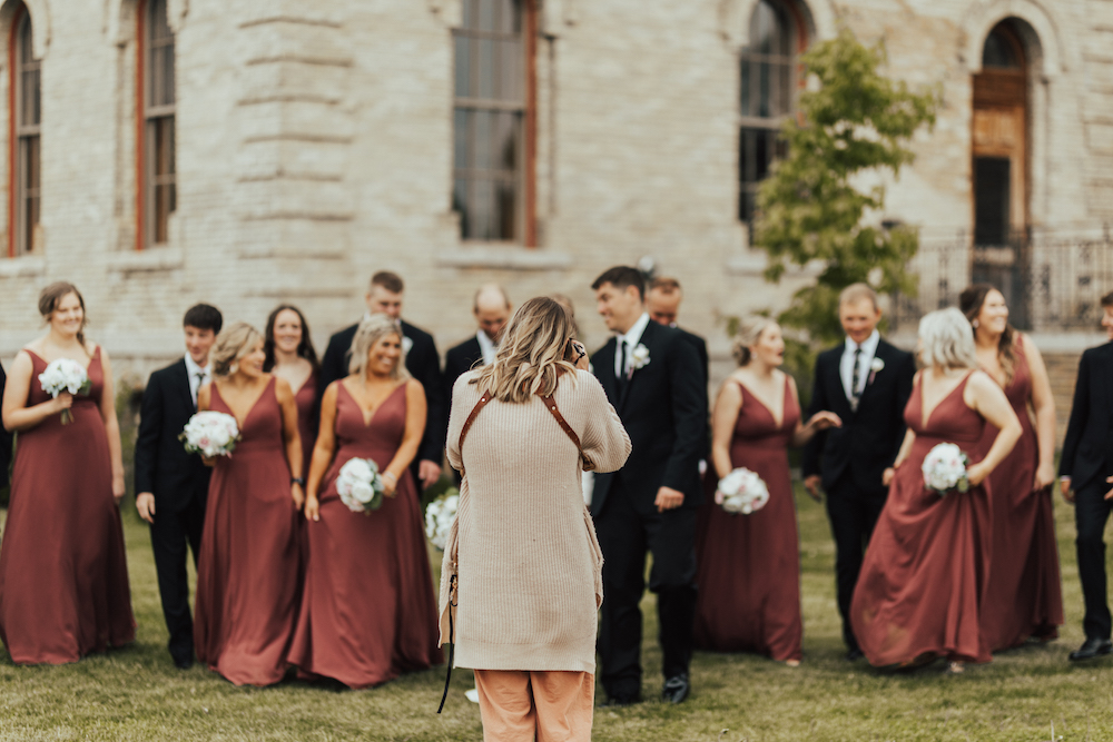 Wedding photographer capturing the bridal party on the wedding day- how to improve client experience.
