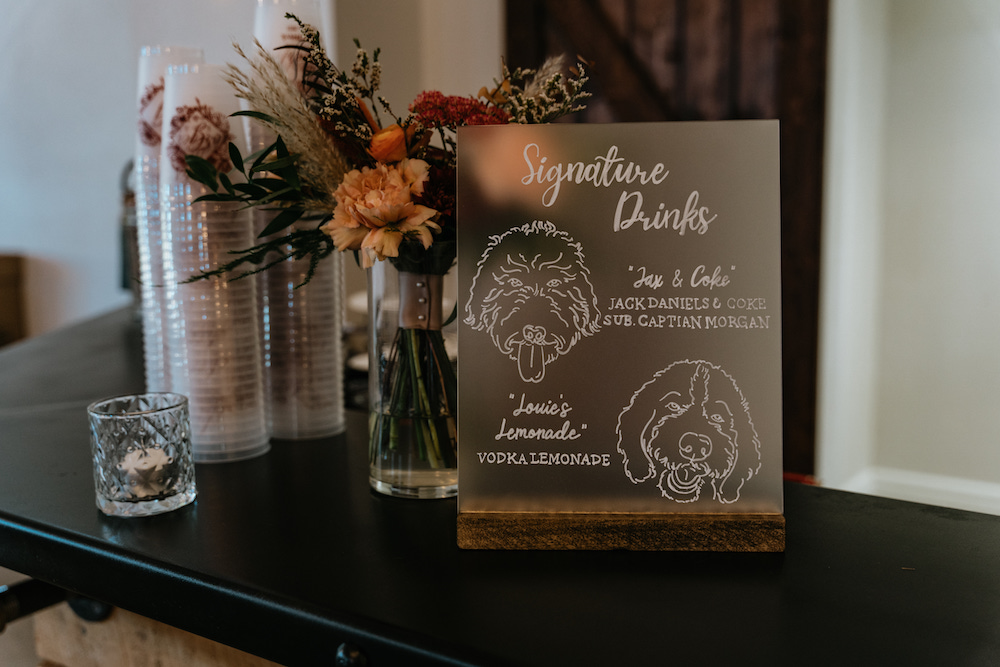 Custom signature wedding drinks with portraits of the couple's dogs.
